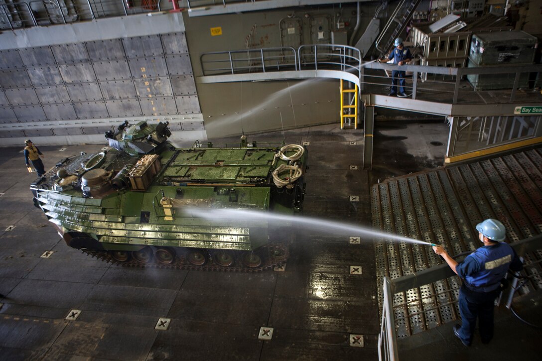 An assault amphibious vehicle gets washed down before entering the well deck of the USS Green Bay, March 9. The 15th MEU is deployed as part of the Peleliu Amphibious Ready Group as a U.S. Central Command theatre reserve force, providing support for maritime security operations and theatre security cooperation efforts in the U.S. 5th Fleet area of responsibility. (U.S. Marine Corps photo by Cpl. Bobby J. Gonzalez/Released)