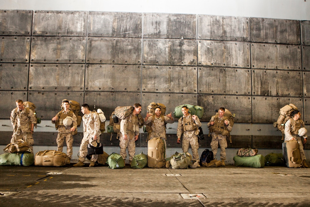 Marines with Battalion Landing Team 3/5, 15th Marine Expeditionary Unit, prepare to load onto a landing craft air cushion aboard the USS Green Bay, March 9. The 15th MEU is deployed as part of the Peleliu Amphibious Ready Group as a U.S. Central Command theatre reserve force, providing support for maritime security operations and theatre security cooperation efforts in the U.S. 5th Fleet area of responsibility. (U.S. Marine Corps photo by Cpl. Bobby J. Gonzalez/Released)