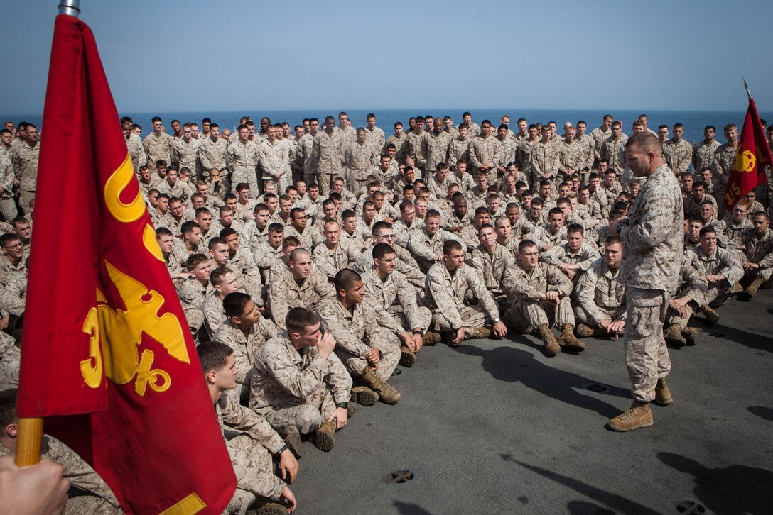 Lieutenant Col. Christeon Griffin, battalion commander, Battalion Landing Team 3/5, 15th Marine Expeditionary Unit, addresses his Marines after a Bronze Star pinning ceremony aboard USS Green Bay, March 3. Peterson received the award for his extraordinary guidance, zealous initiative and total dedication to duty while securing the historically violent and enemy controlled urban area of Wishtan and the surrounding region. The 15th MEU is deployed as part of the Peleliu Amphibious Ready Group as a U.S. Central Command theatre reserve force, providing support for maritime security operations and theatre security cooperation efforts in the U.S. 5th Fleet area of responsibility. (U.S. Marine Corps photo by Cpl. Bobby J. Gonzalez/Released)