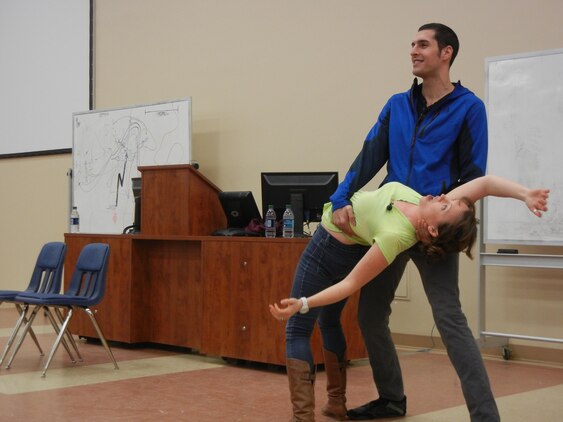 Actors Chris Beier and Courtney Abbott riff on gender roles as they act out a scene in which Beier rescues her from captivity, during a performance of “Sex Signals” at Heywood Hall on March 5. 