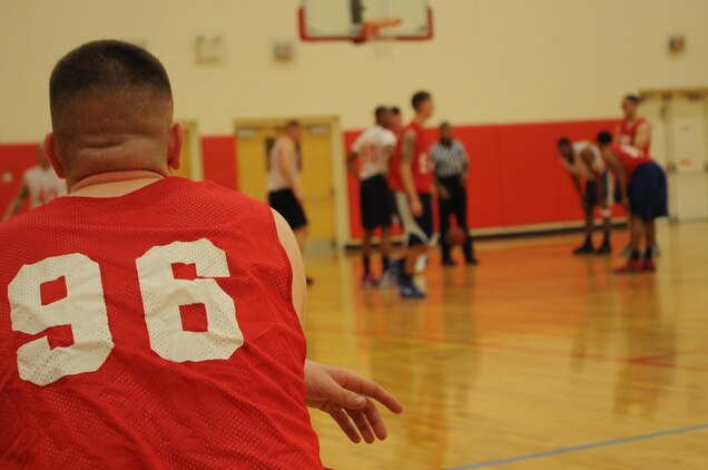 Blake Ewing, guard for TBS Ordnance, waits by the scorer’s table before checking into an intramural basketball game against CI Weapons. Weapons prevailed in a tight game 53-52.