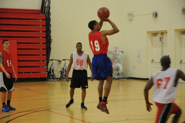 Martin Fuller, guard for TBS Ordnance, rises for a jumper against CI Weapons during an intramural basketball game at Barber Physical Activity Center on March 4. Fuller missed a potential game-winning shot at the buzzer and his team lost 53-52.