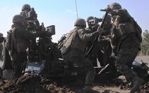 Marines and sailors with 3rd Battalion, 10th Marine Regiment, 2nd Marine Division, conducted a live-fire training exercise with M777A2 155 mm howitzers March 6-8, 2013, aboard Marine Corps base Camp Lejeune. Marines with India Battery load a round into the howitzer to fire down range at simulated tank targets.