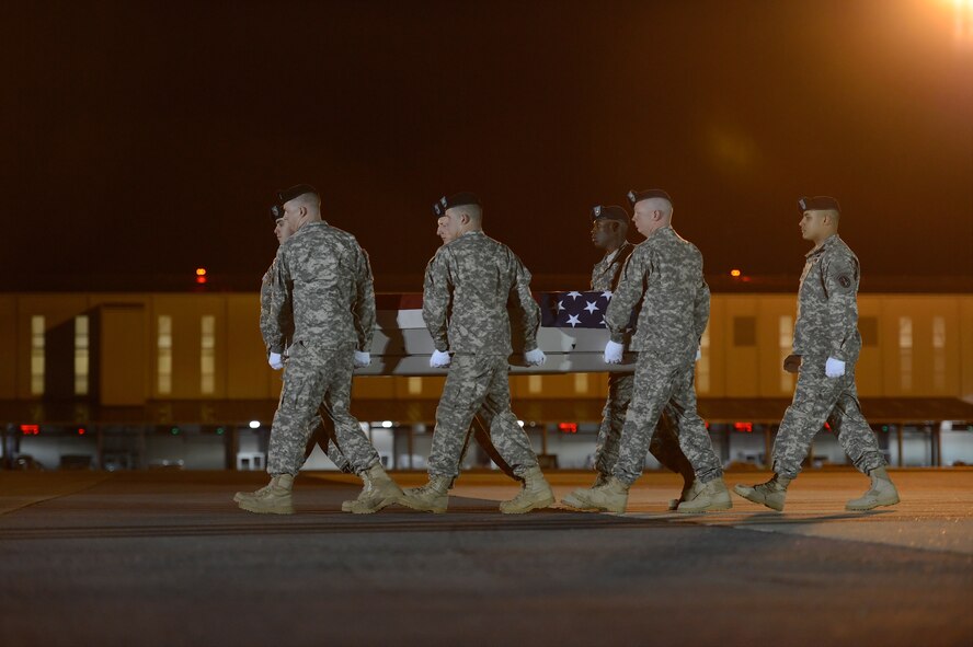 A U.S. Army carry team transfers the remains of Capt. Andrew M. Pedersen-Keel at Dover Air Force Base, Del., March 12, 2013. Pedersen-Keel was assigned to the Company B, 1st Battalion, 3rd Special Forces Group, Ft. Bragg, N.C. (U.S. Air Force photo/Greg L. Davis)