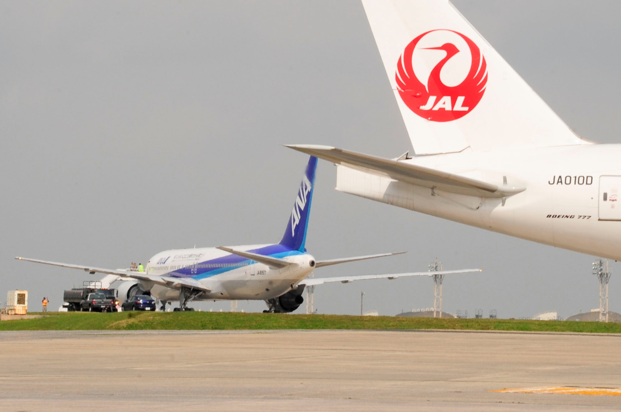 Two of three aircraft sit parked on the flightline of Kadena Air Base, Japan, after being diverted from Naha airfield on March 12, 2013. The 18th Wing and 733rd AMS assisted three aircraft that diverted from Naha airfield with services such as refueling. Kadena Air Base is a divert location for Naha airfield and is occasionally used when weather or other situations prevent aircraft from landing at Naha. (U.S. Air Force photo/Staff Sgt. Darnell T. Cannady)