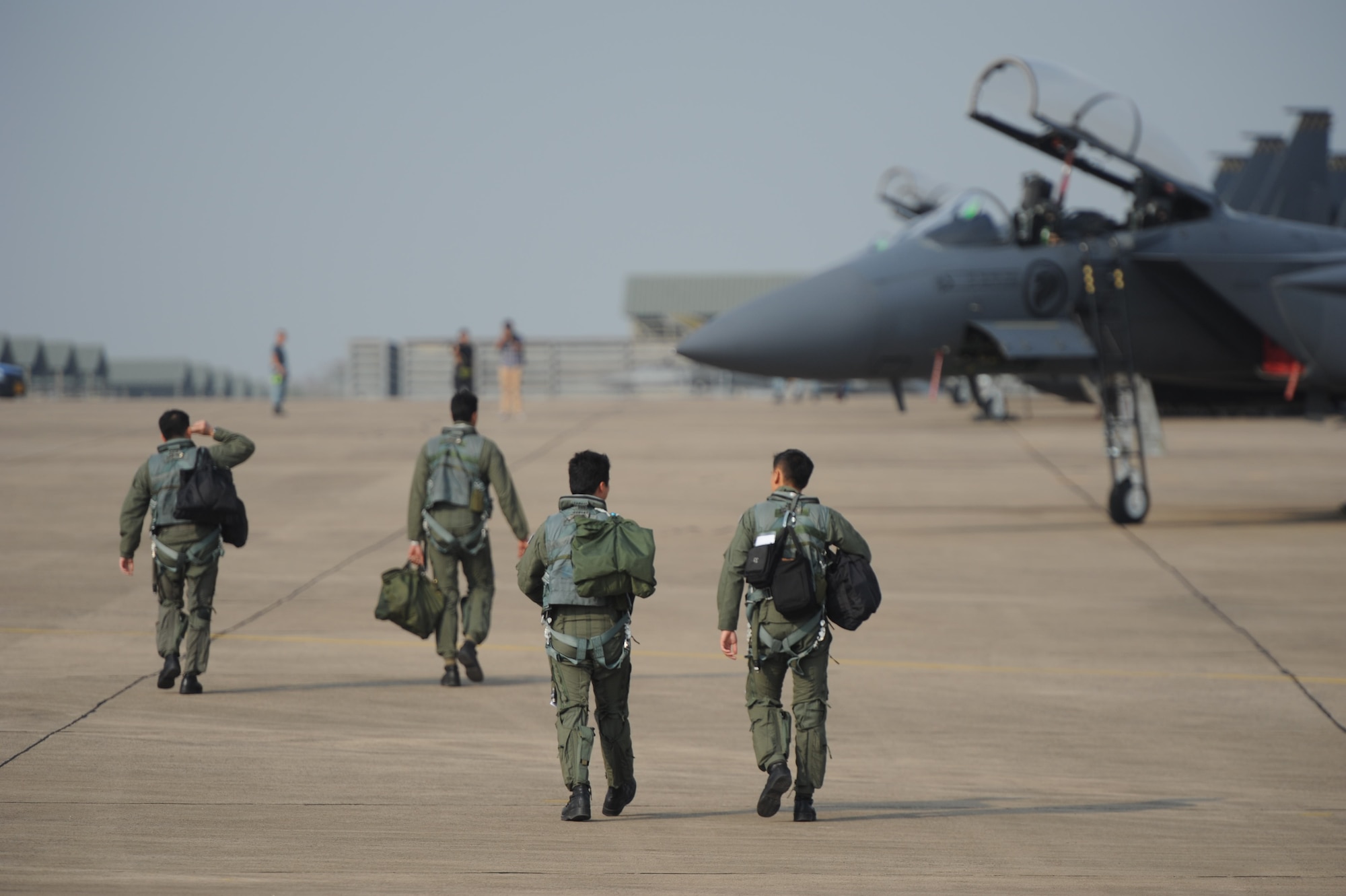 Republic of Singapore Air Force pilots step to their F-15SG Eagle aircraft before a training mission during Cope Tiger 13 at Korat Royal Thai Air Force Base, Thailand, March 12, 2013.  More than 300 U.S. service members are participating in CT13, which offers an unparalleled opportunity to conduct a wide spectrum of large force employment air operations and strengthen military-to-military ties with two key partner nations, Thailand and Singapore. (U.S. Air Force photo/2nd Lt. Jake Bailey) 