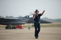 U.S. Air Force Senior Airmen Jeffrey Santella, a crew chief, prepares an F-15C Eagle for flight operations during Cope Tiger 13 at Korat Royal Thai Air Force Base, Thailand, March 11, 2013.  Santella is assigned to the 44th Aircraft Maintenance Unit at Kadena Air Base, Japan, and is a native of Fort Myers, Fla. More than 300 U.S. service members are participating in CT13, which offers an unparalleled opportunity to conduct a wide spectrum of large force employment air operations and strengthen military-to-military ties with two key partner nations, Thailand and Singapore. (U.S. Air Force photo/2nd Lt. Jake Bailey)