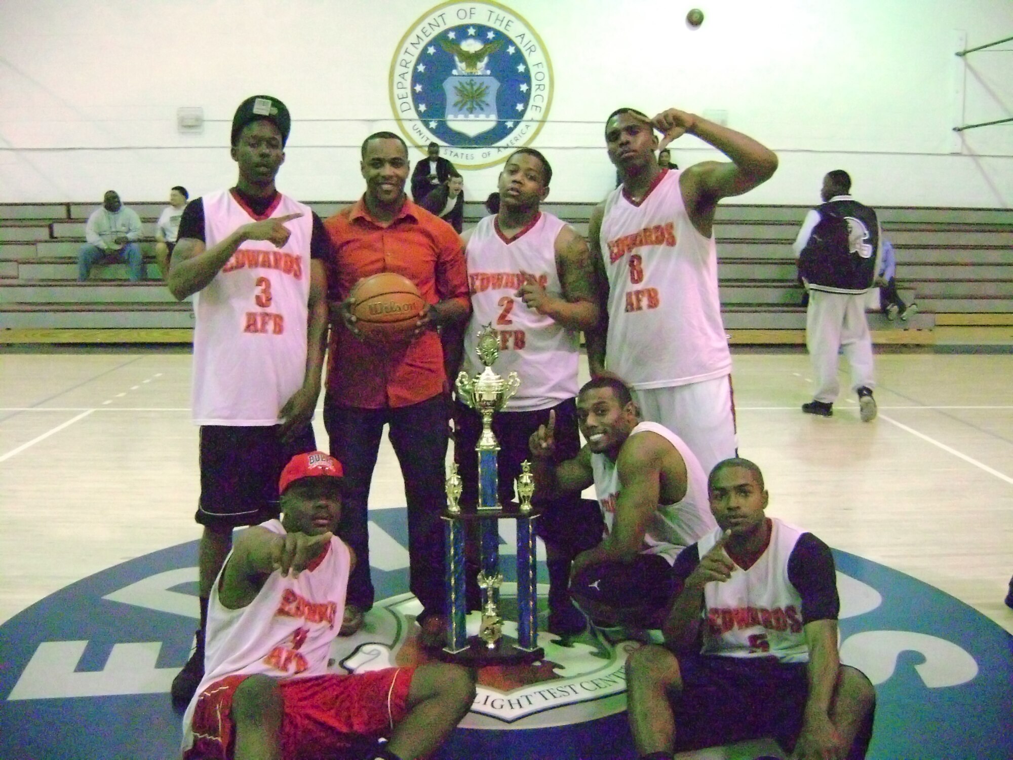 The 412th Security Forces Squadron team poses for a victory photo after claiming the 2013 Intramural Basketball Championship title March 7 at the Rosburg Fitness Center with back to back games over the first-place seeded team, the 412th Force Support Squadron. (U.S. Air Force photo by Steven Lowe)
