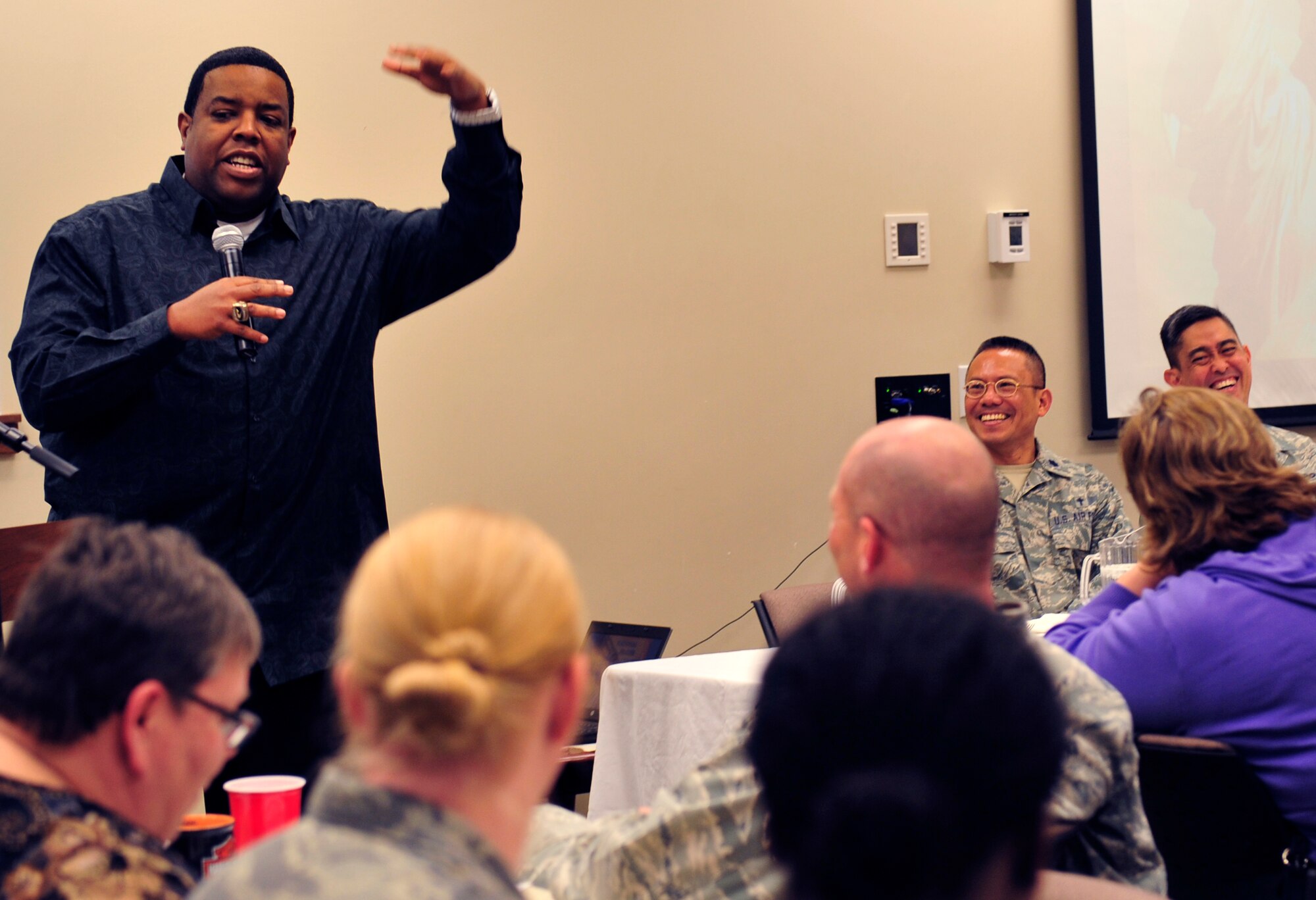 Chip Simmons, chaplain for the Denver Broncos, speaks at the annual National Prayer Luncheon March 6, 2013, at the chapel Fellowship Hall at Buckley Air Force Base, Colo. More than 220 military members and civilians fellowshipped, worshipped and feasted on food served by the chapel. (U.S. Air Force photo by Airman 1st Class Darryl Bolden Jr./Released)