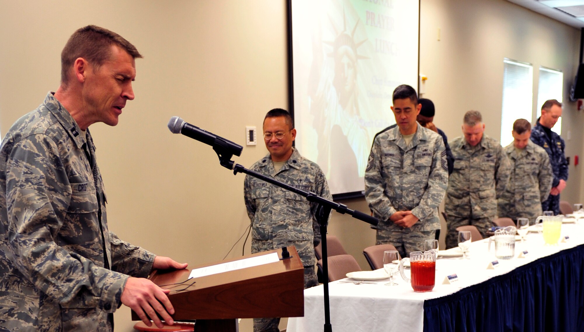 Chaplain (Capt.) Randy Croft, 460th Space Wing, gives the opening prayer and greetings during the National Prayer Luncheon March 6, 2013, at the chapel Fellowship Hall at Buckley Air Force Base, Colo. The luncheon was held to bring together the chapel community. (U.S. Air Force photo by Airman 1st Class Darryl Bolden Jr./Released)