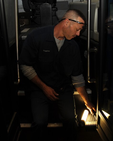 Tyler Cagnina, 2nd Logistics Readiness Squadron heavy mobile equipment mechanic, repairs the door on a bus on Barksdale Air Force Base, La., March 12. LRS vehicle mechanics perform everything from routine oil changes to more complex maintenance to include engine rebuilds. (U.S. Air Force photo/Senior Airman Sean Martin)