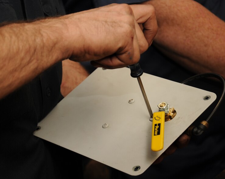 Tyler Cagnina, 2nd Logistics Readiness Squadron heavy mobile equipment mechanic, repairs an air pressure valve on Barksdale Air Force Base, La., March 12. The LRS vehicle maintenance section maintains around 800 vehicles to include Humvees, every day-use vehicles, buses and maintenance trucks used on the flight line. (U.S. Air Force photo/Senior Airman Sean Martin)
