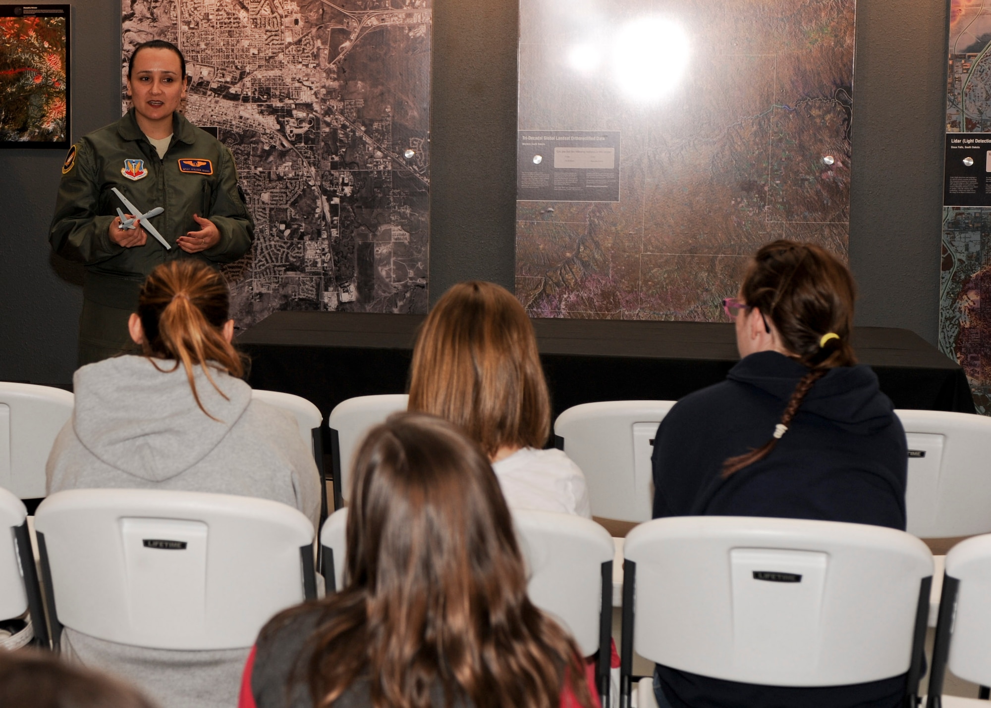 Master Sgt. Koleen Riggs, 432nd Attack Squadron sensor operator, speaks about her career during the Women of Aviation event at the South Dakota Air and Space Museum in Box Elder, S.D., March 9, 2013. Riggs has been an MQ-9 Reaper sensor operator for the last two and one half years, where she employs airborne to actively or passively acquire, track and monitor airborne, maritime and ground objects. (U.S. Air Force photo by Airman 1st Class Anania Tekurio/Released)