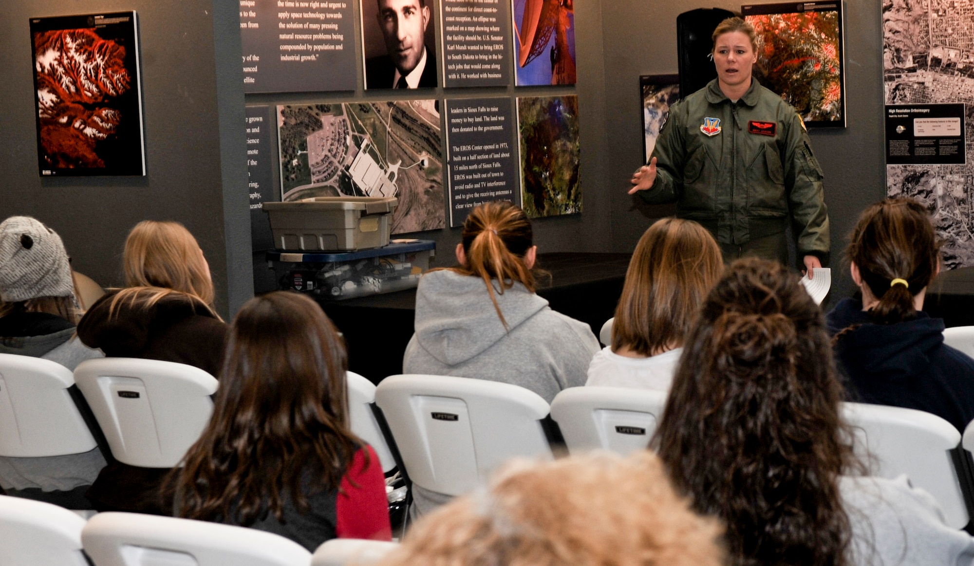 Capt. Nicole Jansen, 34th Bomb Squadron B-1 pilot, speaks about her career during the Women of Aviation event at the South Dakota Air and Space Museum in Box Elder, S.D., March 9, 2013. Jansen recounted her aspirations to become a pilot, and how a book about the U.S. Air Force Academy given to her by a ninth-grade teacher fueled her desire to attend to the academy and become an Air Force pilot. (U.S. Air Force photo by Airman 1st Class Anania Tekurio/Released)  