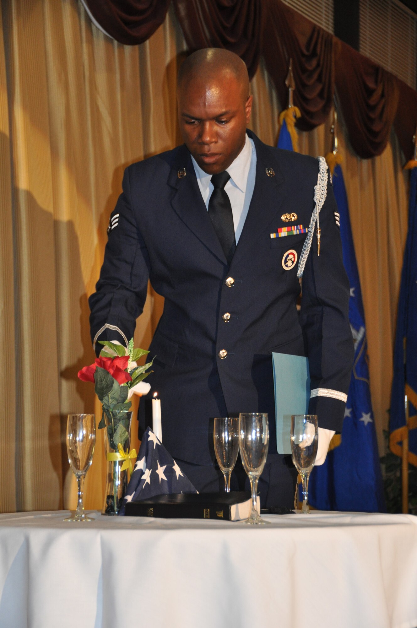 JOINT BASE MCGUIRE-DIX-LAKEHURST, N.J. - Senior Airman Eddie Jones, 514th Honor Guard member, prepares to read the history of the Table of Honor during the 514th Air Mobility Wing's Annual Awards Banquet held March 9 at Tommy B's Community Center.  More than 70 Reserve Airmen were recognized for their superior performance during 2012. (U.S. Air Force photo/Master Sgt. Donna T. Jeffries)