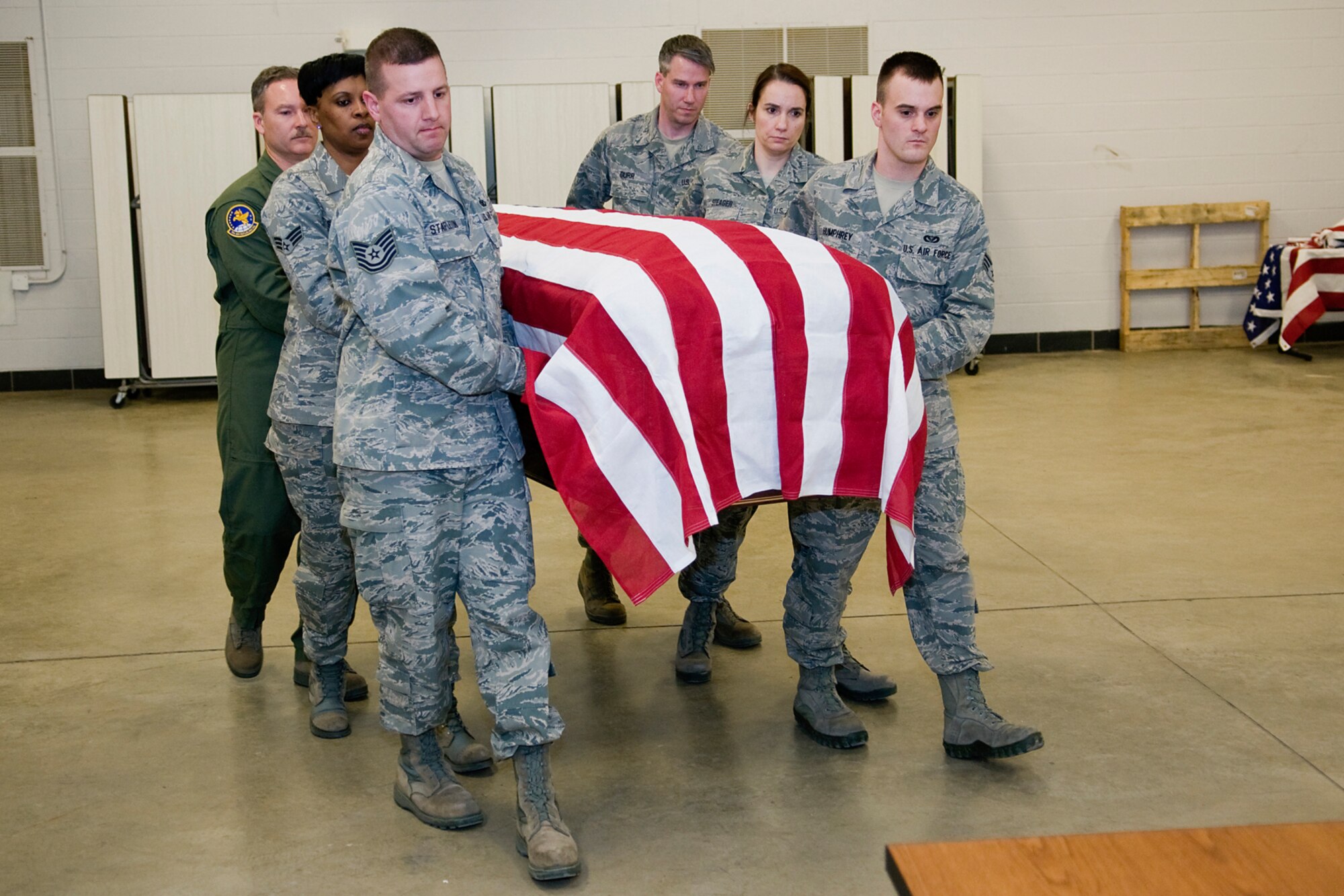 GRISSOM AIR RESERVE BASE, Ind. -- Grissom honor guard trainees practice carrying a casket during honor guard training held here March 5. While performing military funeral honors for retired servicemembers, ceremonial guardsmen bear the casket to its final resting spot. (U.S. Air Force photo/Tech. Sgt. Mark R. W. Orders-Woempner)
