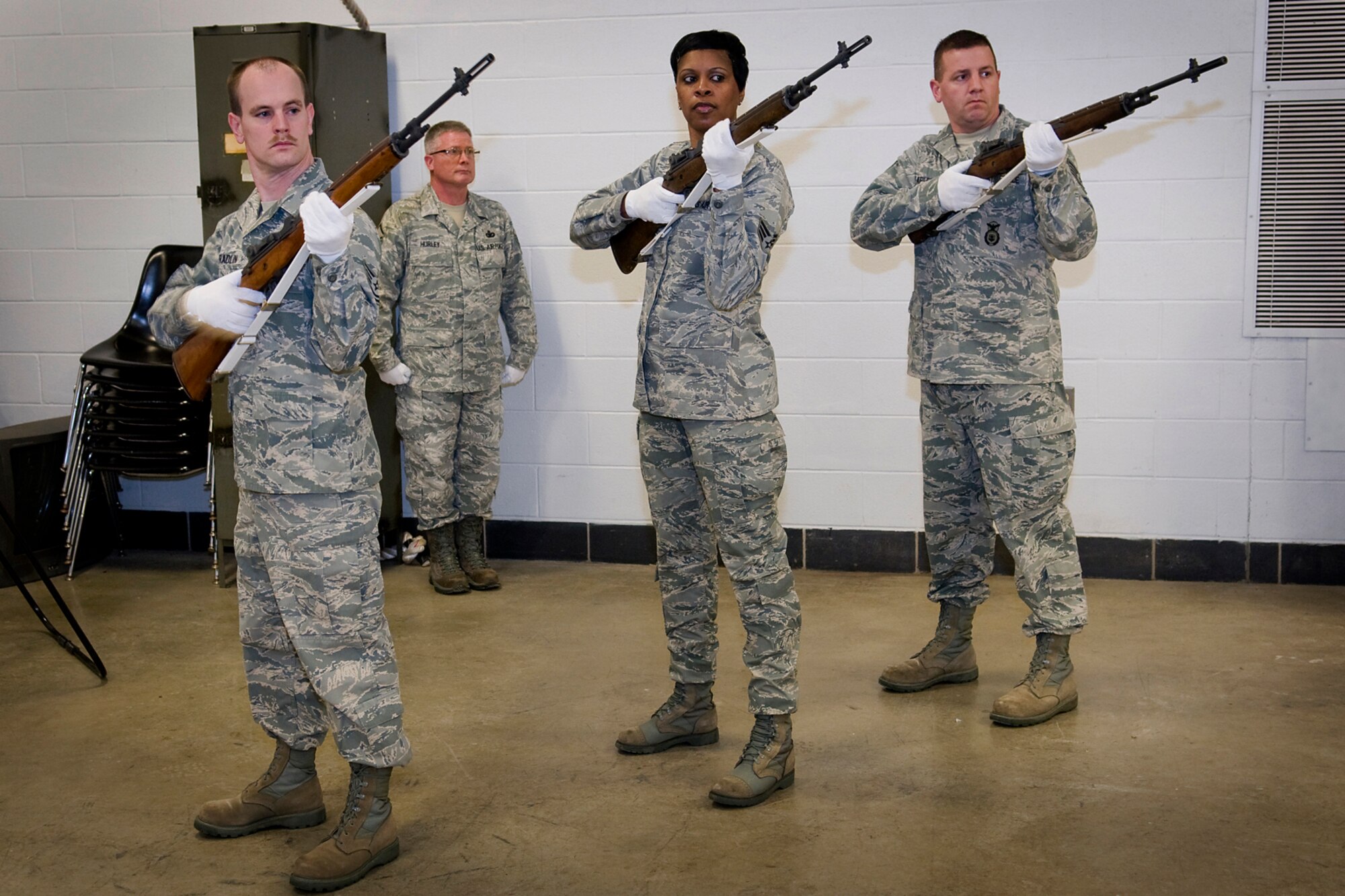 GRISSOM AIR RESERVE BASE, Ind. -- Grissom ceremonial guardsmen participate in a firing party exercise during an honor guard training here March 6. From left to right are Tech. Sgt. Damon Spradlin, 434th Aerospace Medicine Squadron bioenvironmental technician; Master Sgt. William Hurley, 434th Communications Squadron first sergeant; Senior Airman Sharon Stevens, 434th AMDS dental technician; and Tech. Sgt. Nicholas Stapleton, 434th SFS fire team member. (U.S. Air Force photo/Tech. Sgt. Mark R. W. Orders-Woempner)
