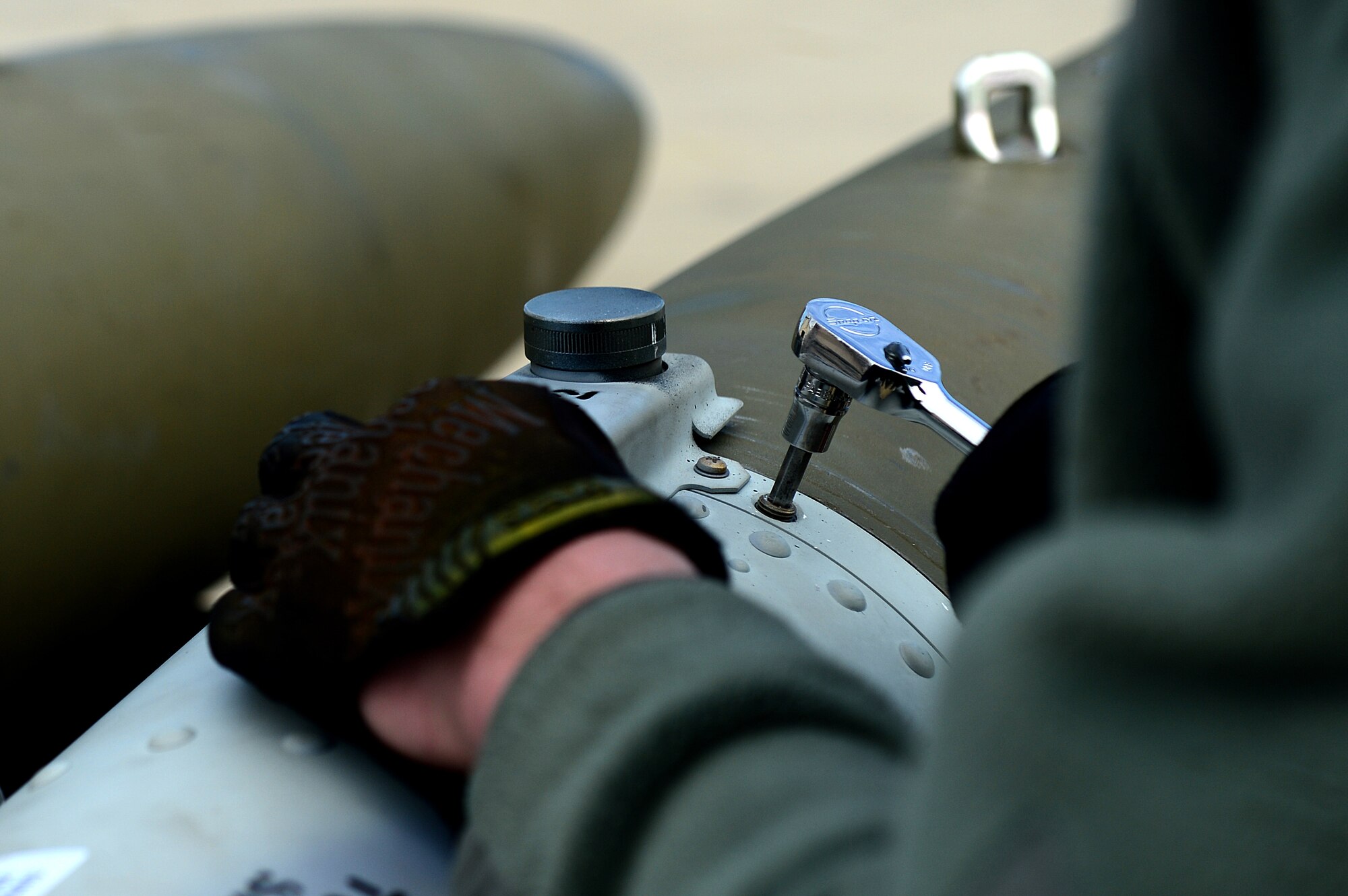 U.S. Air Force Airman 1st Class Douglas Setter, 1st Maintenance Squadron munitions flight technician, puts together a Guided Bomb Unit 32 at Langley Air Force Base, Va., March 5, 2013.  There are currently 182 personnel assigned to the 1st MXS Munitions Flight. (U.S. Air Force photo by Senior Airman Kayla Newman/Released)