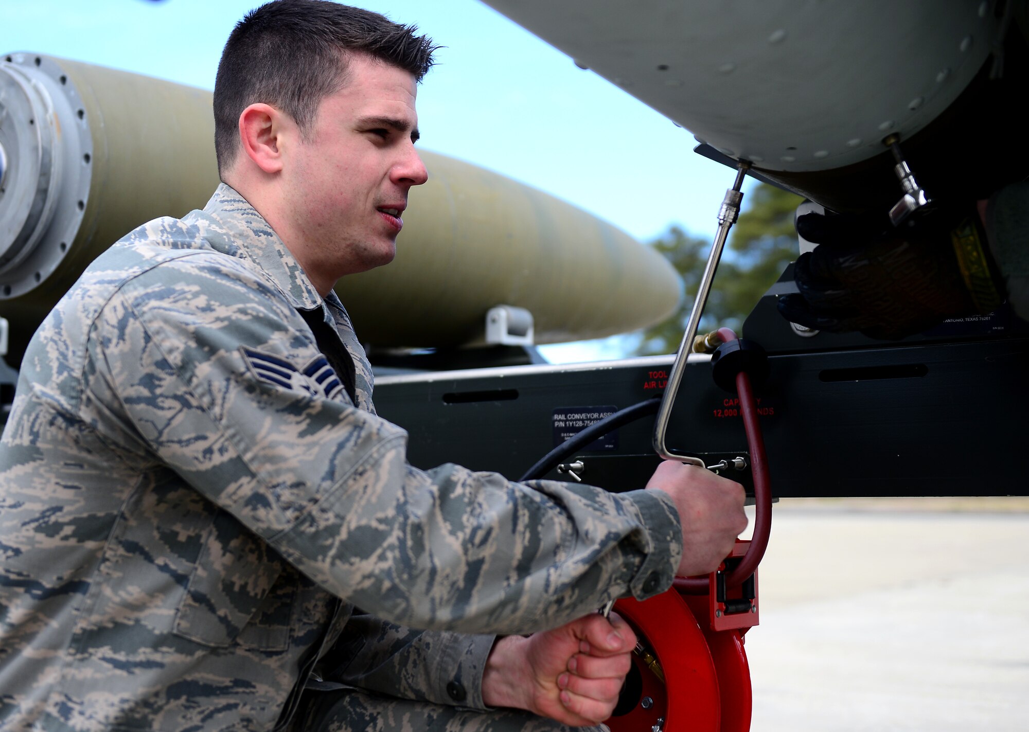 U.S. Air Force Senior Airman Travis Holmes, 1st Maintenance Squadron munitions flight technician, assembles a Guided Bomb Unit 32 at Langley Air Force Base, Va., March 5, 2013.  The Munitions Flight is in charge of providing munitions support for Joint Base Langley-Eustis. (U.S. Air Force photo by Senior Airman Kayla Newman/Released)