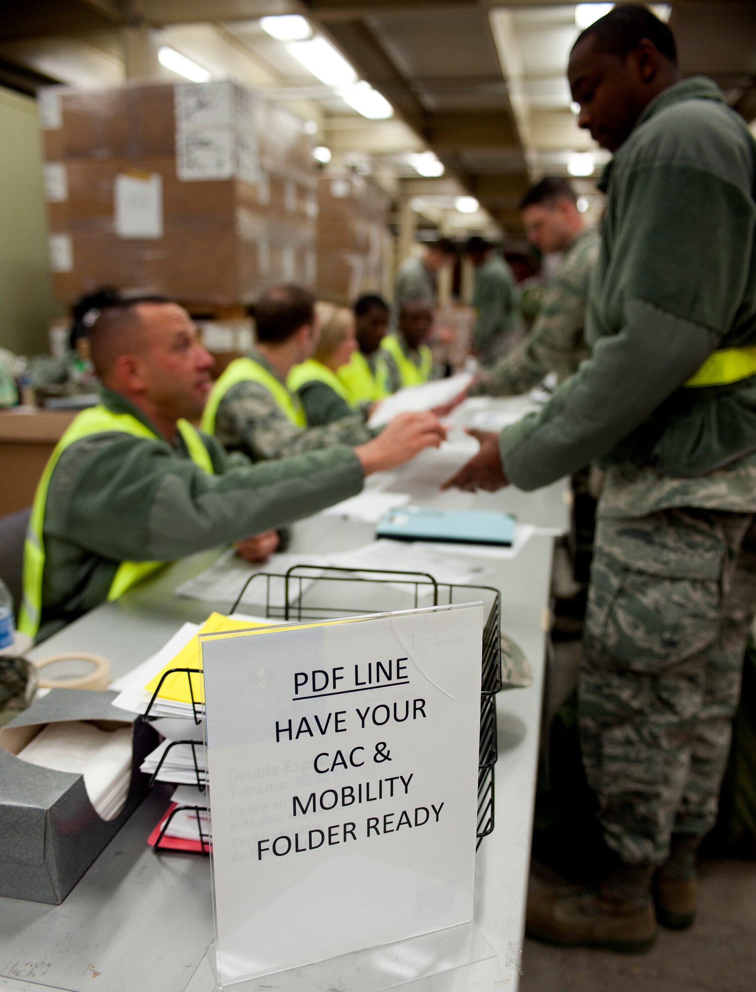 Members of the 436th Airlift Wing outprocess in preparation for deployment as part of an exercise Mar. 2, 2013, at Dover Air Force Base, Del. Over 400 members of the 436th and 512th Airlift Wings participated in a joint Operational Readiness Exercise Mar. 2-8. (U.S. Air Force photo/Master Sgt. Jeanette Spain)