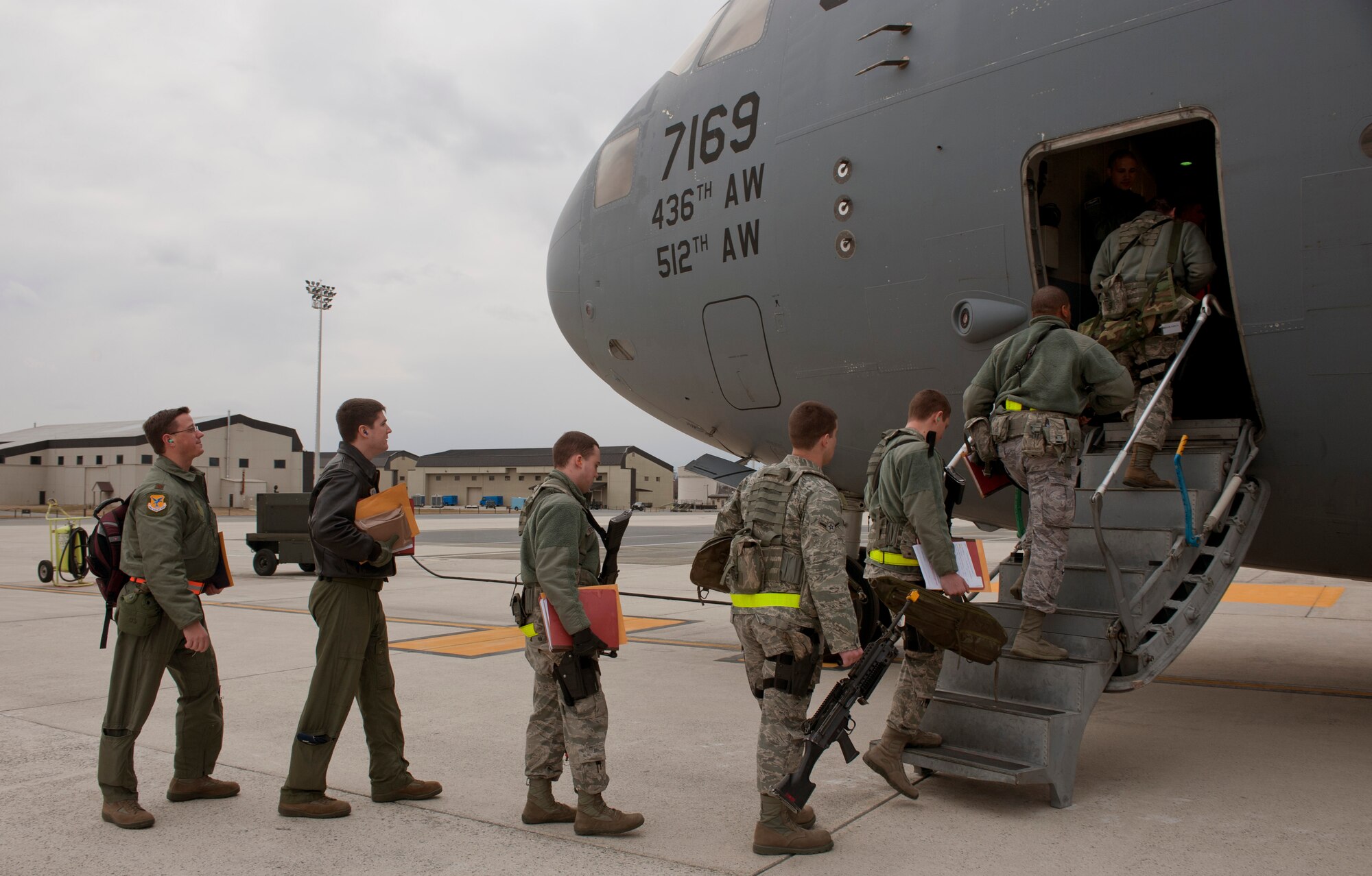 Members of the 436th Airlift Wing board a C-17 Globemaster III March 2, 2013, on the flightline at Dover Air Force Base, Del. More than 250 members of the 436th AW participated in an Operational Readiness Exercise Mar. 2-8. (U.S. Air Force photo/Master Sgt. Jeanette Spain)
