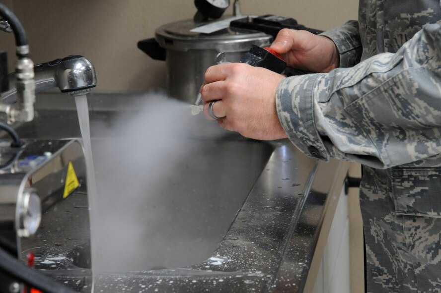 Master Sgt. Denny Shaffer, 2nd Dental Squadron dental lab flight chief, cleans an implant guide on Barksdale Air Force Base, La., March 12. The guides assist surgeons by ensuring proper placement of oral implants. (U.S. Air Force photo/Airman 1st Class Andrew Moua)