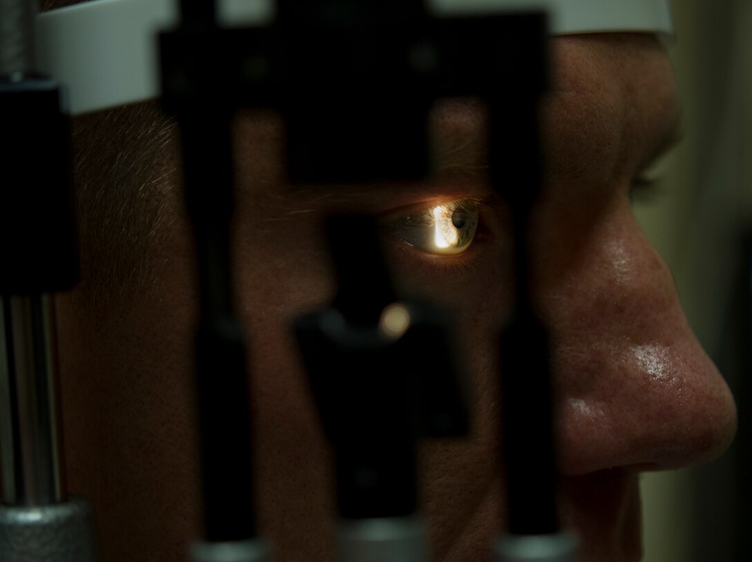 A slit lamp is used to check the cornea, conjunctiva, lids, lashes, and the angles of the eye, at Joint Base Andrews, Md. The binocular slit-lamp examination provides a stereoscopic magnified view of the eye structures in detail, enabling anatomical diagnoses to be made for a variety of eye conditions. (U.S. Air Force photo/Staff Sgt. Perry Aston)