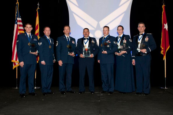 The 2012 Outstanding Airmen of the Year award recipients are, from left to right: Airman of the Year Senior Airman Russell Shirley, assigned to the 214th Air Reconnaissance Group; Noncommissioned Officer of the Year Staff Sgt. William Reid, assigned to the 107th Air Control Squadron; Senior Noncommissioned Officer of the Year Senior Master Sgt. David Juergens, assigned to the 162nd Fighter Wing; First Sergeant of the Year Senior Master Sgt. Marclen Polanco, assigned to the 162nd Fighter Wing; Honor Guard Member Staff Sgt. Ty Alan Goeken, assigned to the 162nd Fighter Wing; Command Chief Master Sergeant Award Tech. Sgt. Susan Koncz, assigned to the 161st Air Refueling Wing and the Major General Donald L. Owens Junior Officer of the Year Capt. Matthew S. Hodges, assigned to the 162nd Fighter Wing. (Air National Guard Photo by Tech. Sgt. Hollie Hansen)