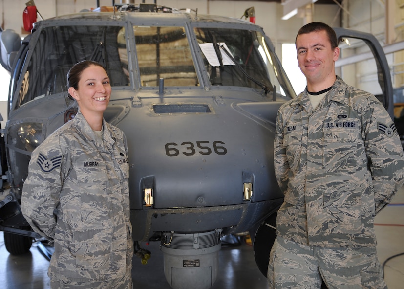 U.S. Air Force Staff Sgt. Danielle Murray, dedicated crew chief (DCC), and Senior Airman Kevin Zrelak, assistant DCC, both from the 723d Aircraft Maintenance Squadron, stand in front of the HH-60G Pave Hawk assigned to their care at Moody Air Force Base, Ga., March 4, 2013. The DCC program gives recognition to outstanding aviation mechanics and ceremonially appoints a DCC and ADCC to oversee the maintenance of a certain aircraft. (U.S. Air Force photo by Senior Airman Eileen Meier/Released)