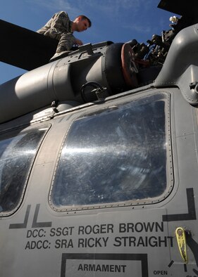 U.S. Air Force Staff Sgt. Roger Brown, 723d Aircraft Maintenance Squadron dedicated crew chief (DCC), works on his assigned HH-60G Pave Hawk at Moody Air Force Base, Ga., March 4, 2013. The DCCs are a group of elite aviation mechanics who oversee the maintenance on aircraft that are ceremonially appointed to them. (U.S. Air Force photo by Senior Airman Eileen Meier/Released) 