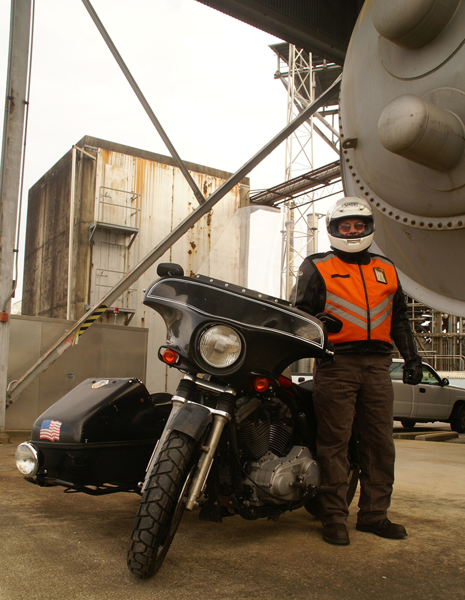 Ricky Taylor, an ATA outside machinist at AEDC’s Engine Test Facility (J-Side Turbine test area), stands by his Harley Davidson Sportster at the beginning of a shift on base. Early last February, he made a commitment to ride his motorcycle to and from work every day for one year, unless safety concerns stood in his way. Recently he successfully reached that goal. (Photo by Philip Lorenz III)