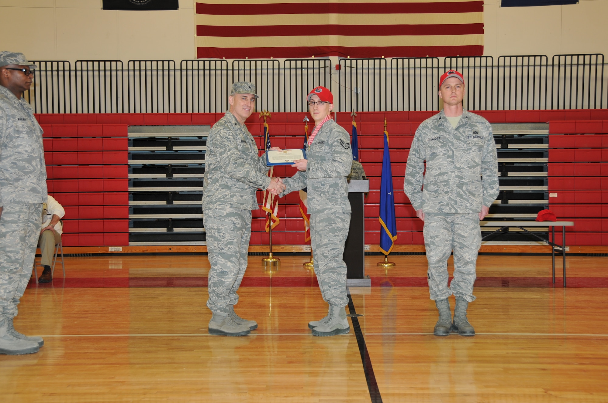 Ohio Air National Guard Chief of Staff, Brig. Gen. Stephen E. Markovich awards Staff Sgt. Josh Blankley, 200th RED HORSE Squadron, the Ohio Distinguished Service Medal with the "V" device during a ceremony held at Camp Perry located in Port Clinton, Ohio, on March 9, 2013. Blankley used his military training to save a life as an impromptu first responder to a traffic accident on June 22, 2012.  (U.S. Air Force photo by Staff Sgt. Joseph Harwood)