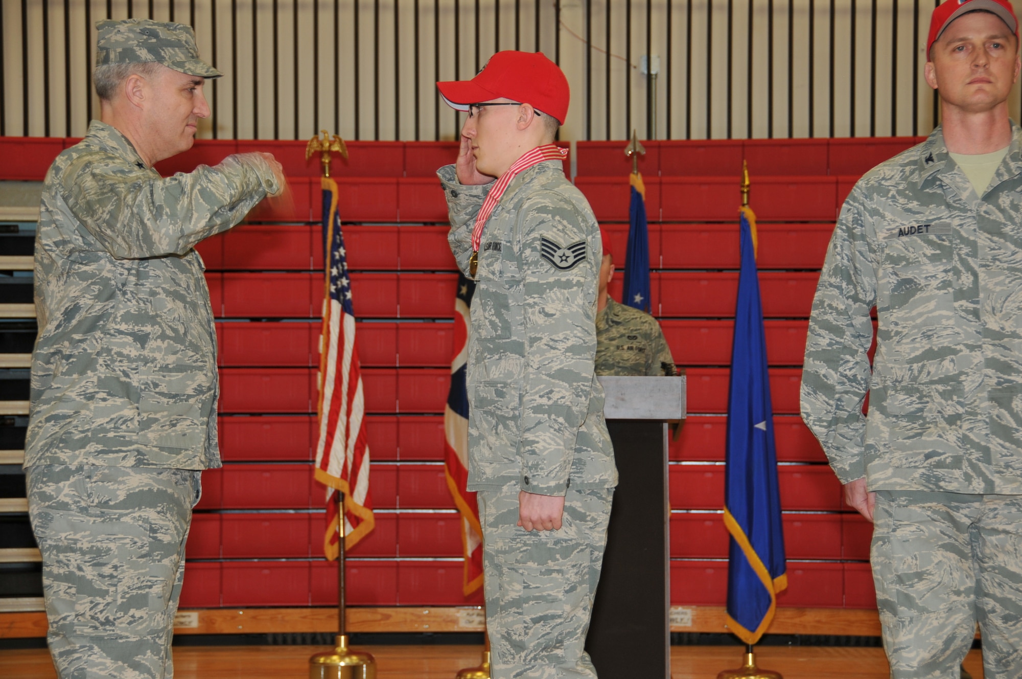 Ohio Air National Guard Chief of Staff, Brig. Gen. Stephen E. Markovich awards Staff Sgt. Josh Blankley, 200th RED HORSE Squadron, the Ohio Distinguished Service Medal with the "V" device during a ceremony held at Camp Perry located in Port Clinton, Ohio, on March 9, 2013. Blankley used his military training to save a life as an impromptu first responder to a traffic accident on June 22, 2012. (U.S. Air Force photo by Staff Sgt. Joseph Harwood)