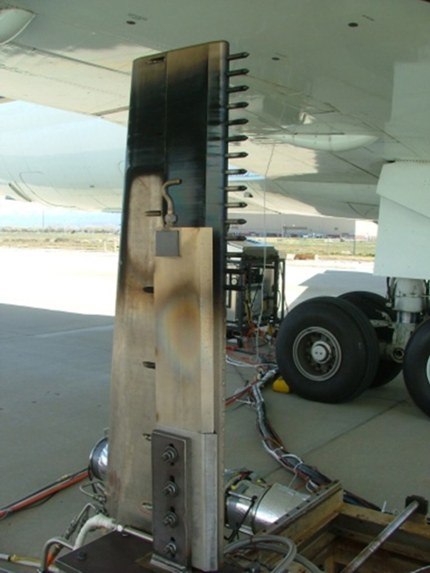 The inset photo is a frontal close-up view of the rake behind the right inboard engine. (NASA photo provided)