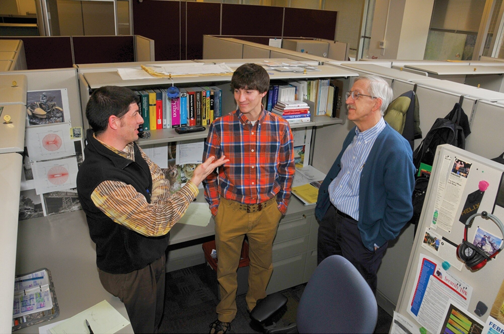 ATA Aerospace engineers James Masters (left) and Ken Tatum (right) discuss an engineering application demonstration to Jacob Griffin, a Warren County High School student. (Photo by Rick Goodfriend)
