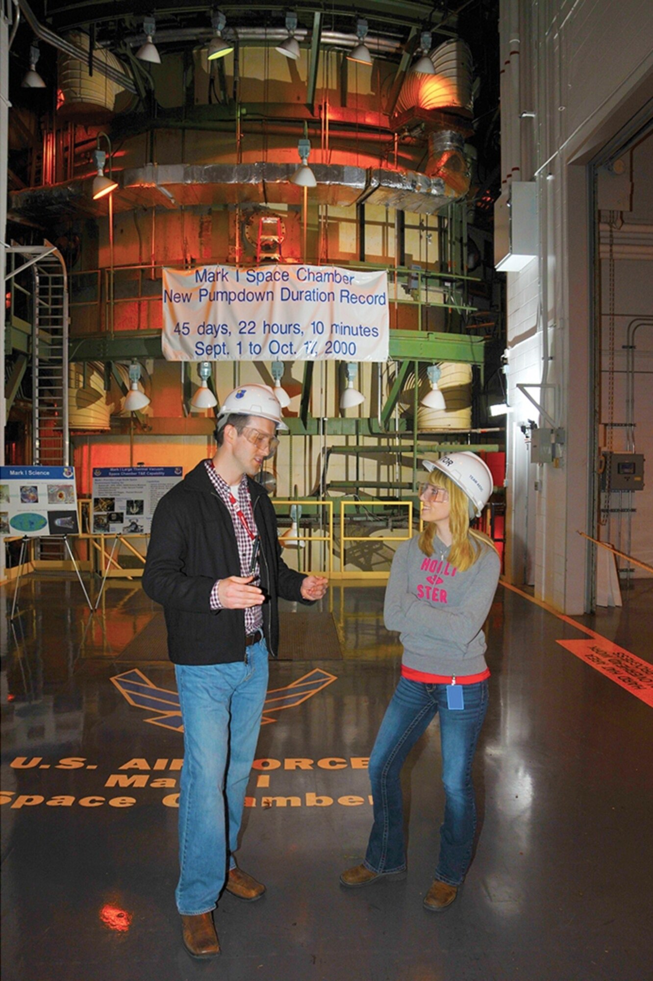 Coffee County Central High School student Katie West (right) listens to ATA aerospace engineering mentor Henry Horne describe testing conducted in the complex’s space chambers. (Photo by Rick Goodfriend)