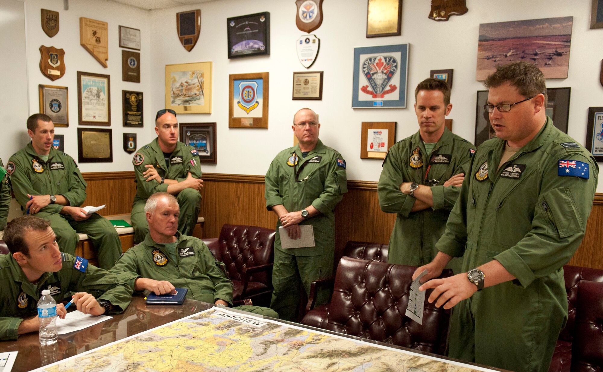Royal Australian Air Force Squadron Leader Patrick Greentree, No. 2 Squadron E-7 A airborne, early warning and control mission commander briefs crew prior to a Red Flag 13-3 training mission at the Nellis Air Force Base, Nev. March 5, 2013.  Red Flag is a realistic combat training exercise involving the air forces of the United States and its allies. The exercise is conducted on the 15,000-square-mile Nevada Test and Training Range, north of Las Vegas.(U.S. Air Force photo by Lawrence Crespo)
