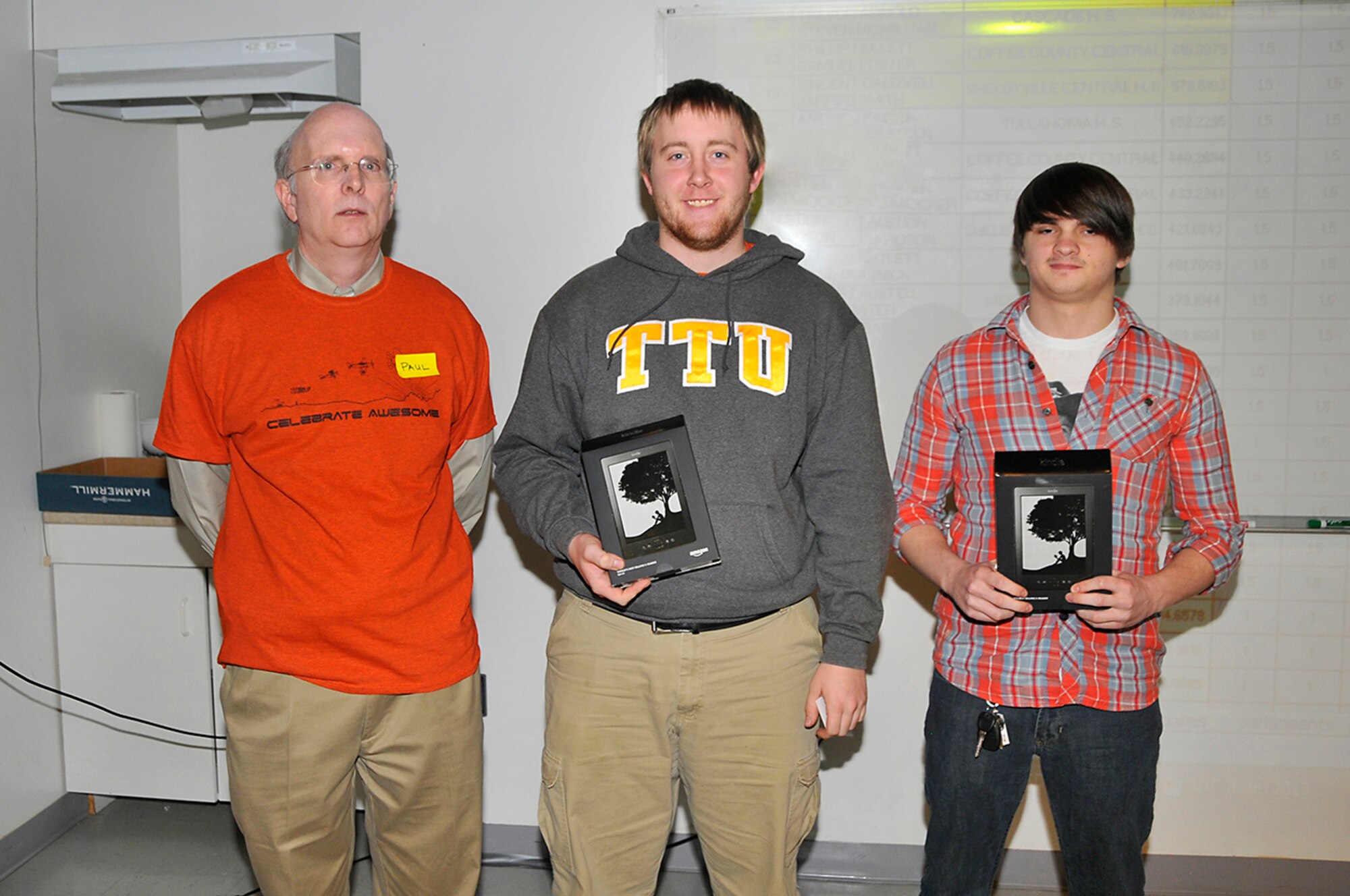 Paul Kelly (left), the National Engineers Week Design Competition coordinator, is shown with second place winners Phillip Hullett (middle) and Samuel Foster (right) from Coffee County Central High School. (Photo by Jacqueline Cowan)