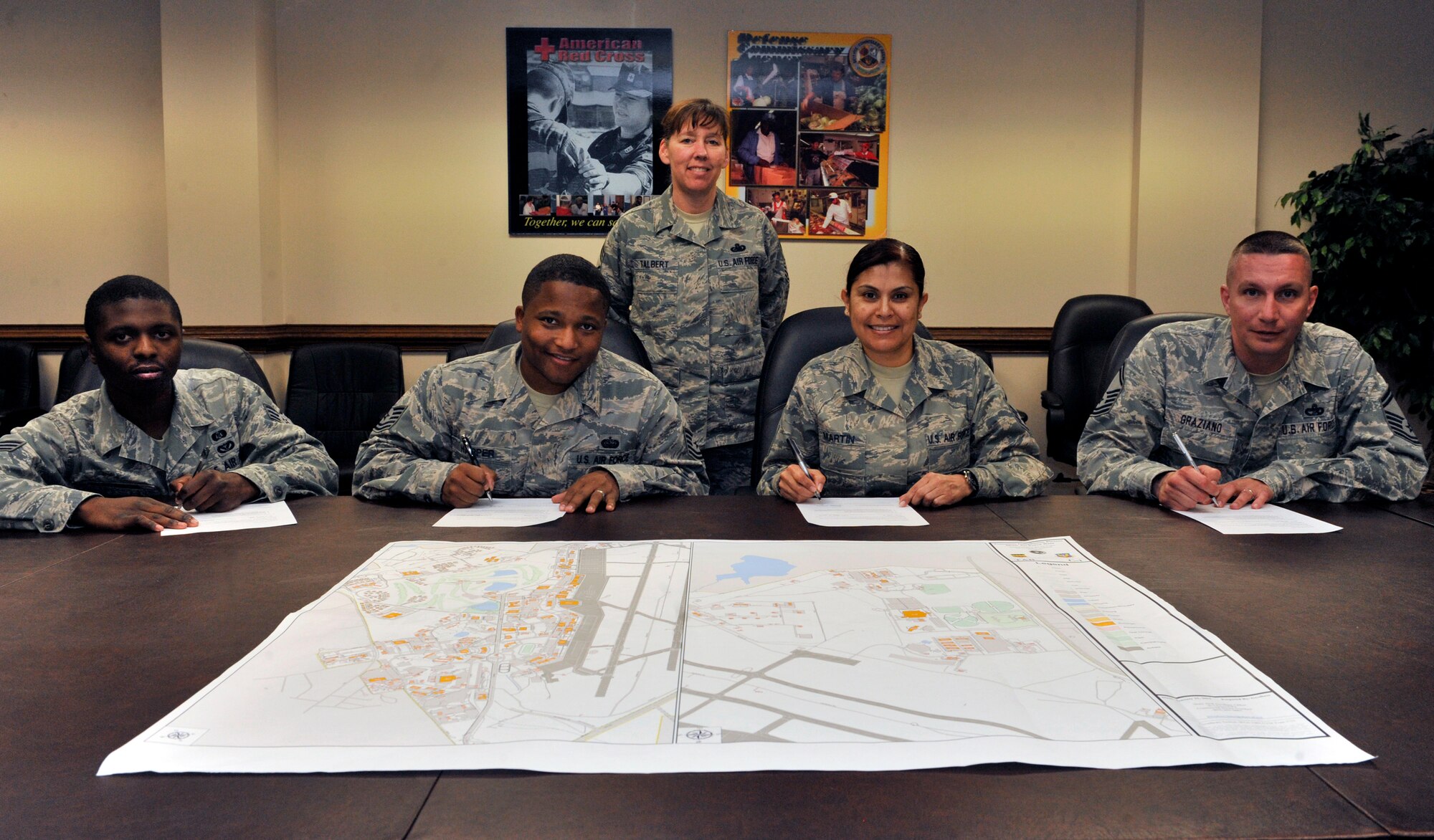 U.S. Air Force Chief Master Sgt. Suzanne Talbert, 20th Mission Support Group superintendent, poses with Senior Airman Michael Blackmon, Rising 4 president, Tech. Sgt. Darius Harper, 5/6 president, Master Sgt. Emilia Martin, Top 3 vice president, and Senior Master Sgt. Frank Graziano, Air Force Sergeants Association Chapter 377 president, during the Adopt-a-Street kickoff, Shaw Air Force Base, S.C., March 11, 2013. Leaders from the private organizations that volunteer to help will sign a contract pledging to maintain a street or location. Talbert is responsible for rallying the organizations together in an effort to keep Shaw clean.  (U.S. Air Force photo by Senior Airman Amber E. N. Jacobs/Released)



