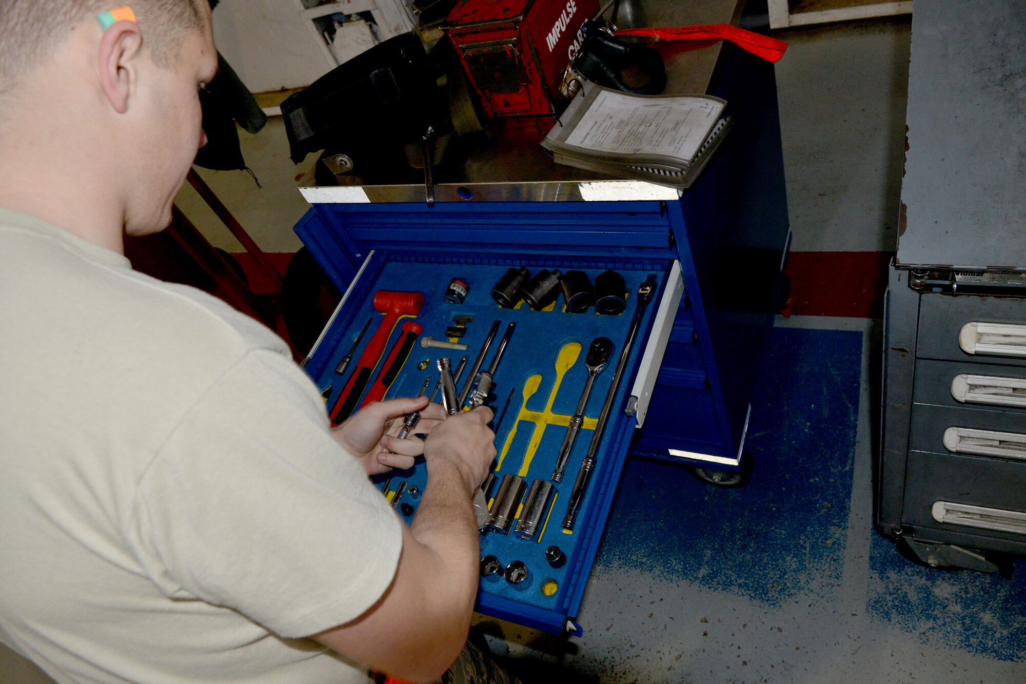 U.S. Air Force Airman 1st Class Jacob Hogsten, 20th Aircraft Maintenance Squadron load crew member, sorts through tools as he gets ready to execute his ammunitions load, Shaw Air Force Base, S.C., March 7, 2013. The process for loading and unloading ammunitions ranges in between 60 and 150 steps. (U.S. 
Air Force photo by Airman 1st Class Ashley L. Gardner/Released)
