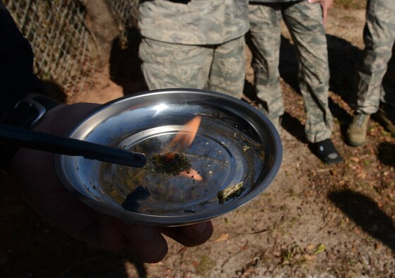 An office of Special Investigations agent demonstrates how to recognize marijuana being burned for NCOs interested in becoming first sergeants during a first sergeants' symposium at Shaw Air Force Base, S.C., March 7, 2013. The symposium is for NCOs who are interested in becoming a first sergeant. They learned the duties that are associated with the job, received advice, as well as asked questions. (U.S. Air Force photo by Senior Airman Tabatha Zarrella/Released)
