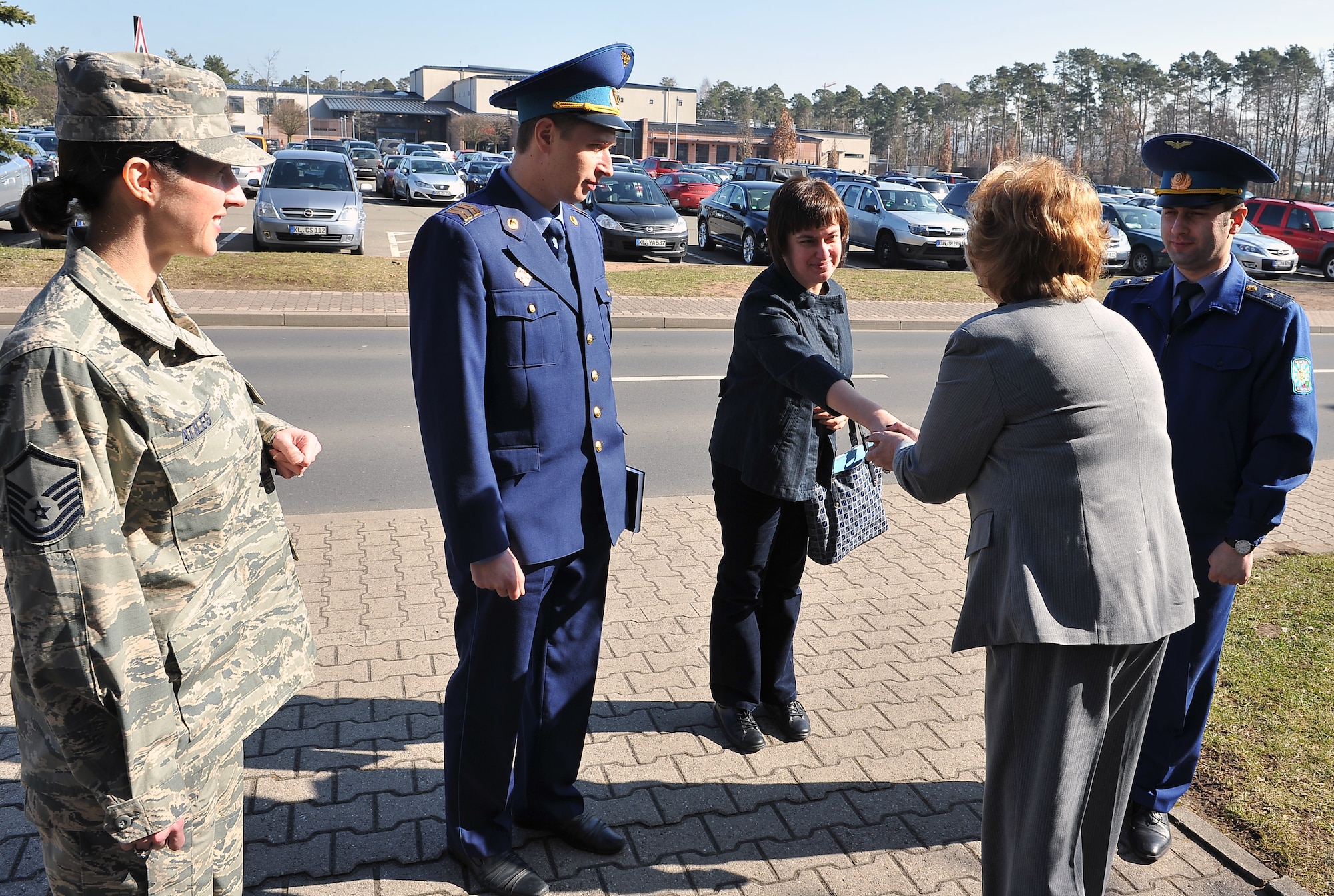 Kathy Latzke, 86th Force Support Squadron Airmen and Family Readiness Center director, greets Ukrainian military members, March 5, 2013, Ramstein Air Base, Germany. Members of the Ukrainian military visited the NCO academy to continue their professional military education operations and increase their knowledge in enlisted empowerment and leadership. (U.S. Air Force photo/Airman 1st Class Dymekre Allen)