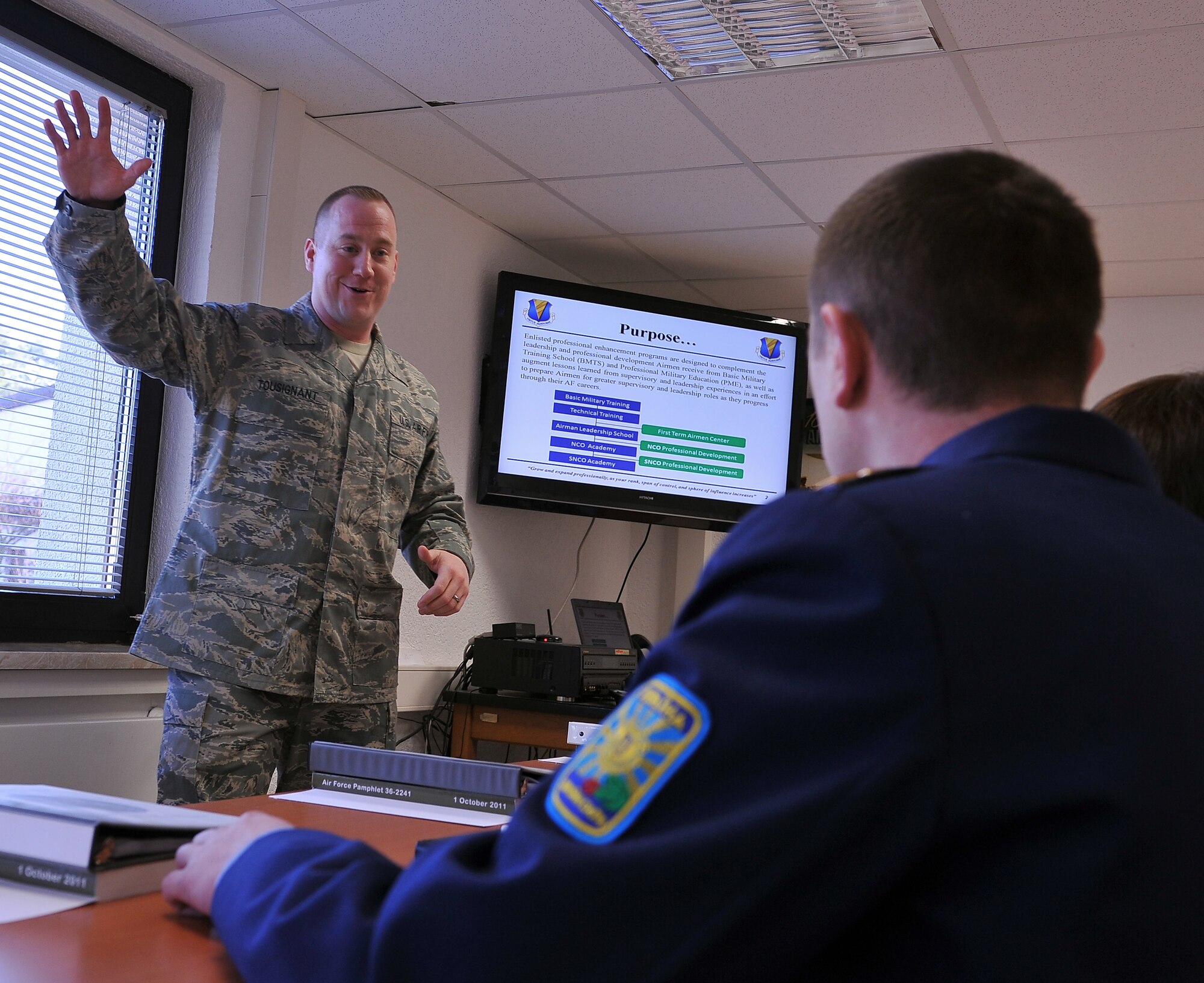 Master Sgt. Etienne P. Tousignant, 86th Force Support Squadron first term Airman course instructor, briefs visitors from the Ukrainian military on the importance of introducing new Airmen to the Air Force, as well as to the base, March 5, 2013, Ramstein Air Base, Germany. Members of the Ukrainian military visited the NCO academy to continue their professional military education operations and increase their knowledge in enlisted empowerment and leadership. (U.S. Air Force photo/Airman 1st Class Dymekre Allen) 