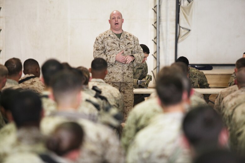 U.S. Marine Corps Staff Sgt. Glen Silva, a wounded warrior and warrior liaison for Feherty's Troops First Foundation, speaks to Marines at a town hall meeting at Camp Leatherneck, Afghanistan, March 2. Silva returned to Camp Leatherneck as part of Operation Proper Exit, which sends wounded warriors back to the forward operating bases they were medically evacuated from. (U.S. Marine Corps photo/Cpl. Lia Adkins)
