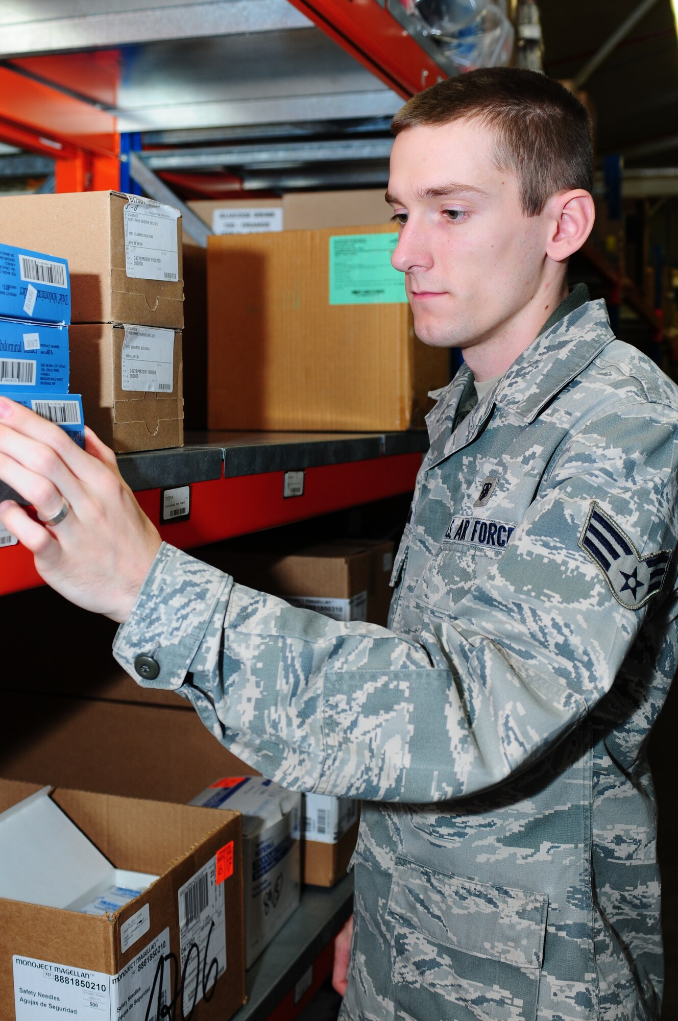 ROYAL AIR FORCE LAKENHEATH, England -- Senior Airman Evan Millard, 48th Medical Group medical logistics technician, examines inventory for quality control measures Feb. 4, 2013. Millard was nominated because he displays the core value of "Excellence in All We Do." (U.S. Air Force photo by Airman 1st Class Dana J. Butler)