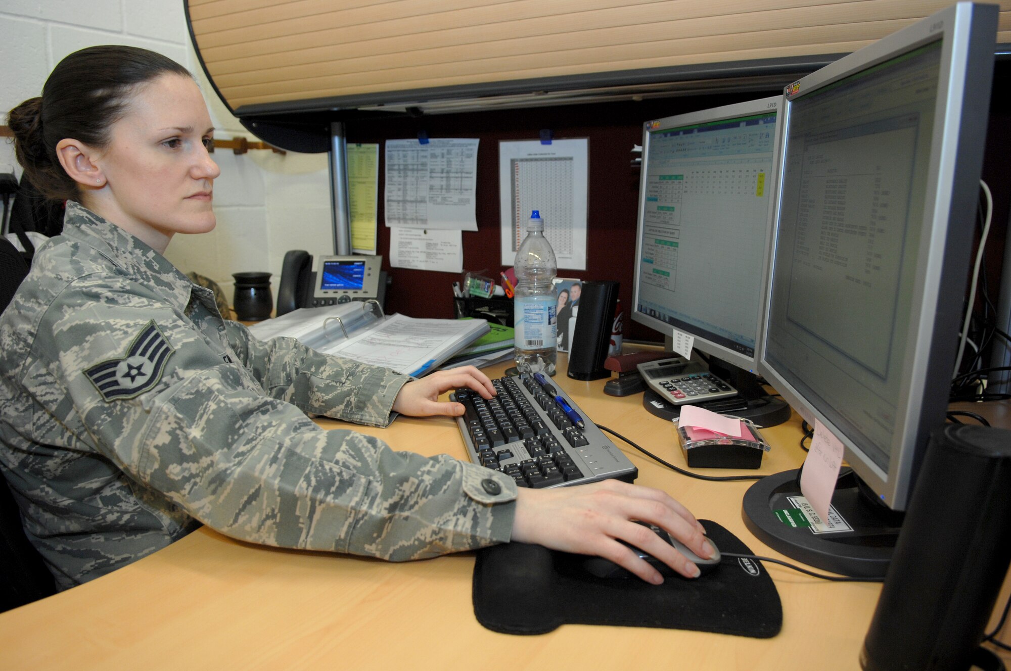 Staff Sgt. Shylynn Lewis, 352nd Special Operations Maintenance Squadron maintenance management analysis NCO in charge, reviews aircraft maintenance data for a presentation provided to senior leadership March 11, 2013, on RAF Mildenhall, England. (U.S. Air Force photo by Airman 1st Class Dillon Johnston/Released)
