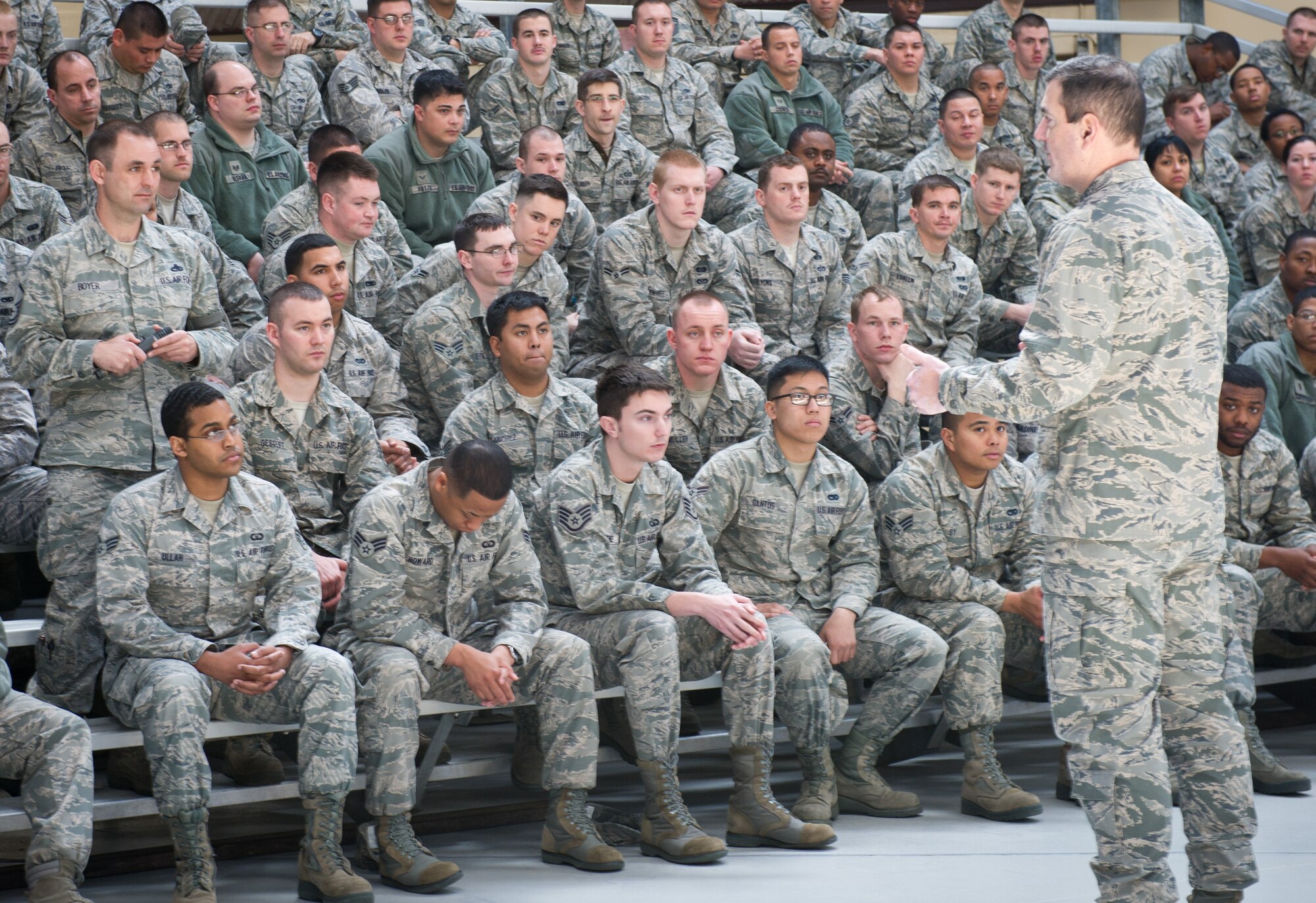 YOKOTA AIR BASE, Japan -- Col. Mark August, 374th Airlift Wing commander speaks to Airmen about the importance of preserving and protecting Yokota's combat and critical mission capabilities amid budget challenges during a commander's all call at Yokota Air Base, Japan, March 12, 2013. August stressed that solutions will require a team effort and often flow from the bottom up. (U.S. Air Force photo by Senior Airman Andrea Salazar)