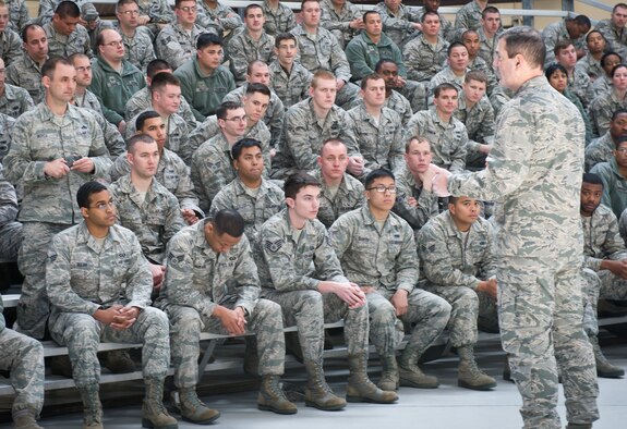 YOKOTA AIR BASE, Japan -- Col. Mark August, 374th Airlift Wing commander speaks to Airmen about the importance of preserving and protecting Yokota's combat and critical mission capabilities amid budget challenges during a commander's all call at Yokota Air Base, Japan, March 12, 2013. August stressed that solutions will require a team effort and often flow from the bottom up. (U.S. Air Force photo/Senior Airman Andrea Salazar)