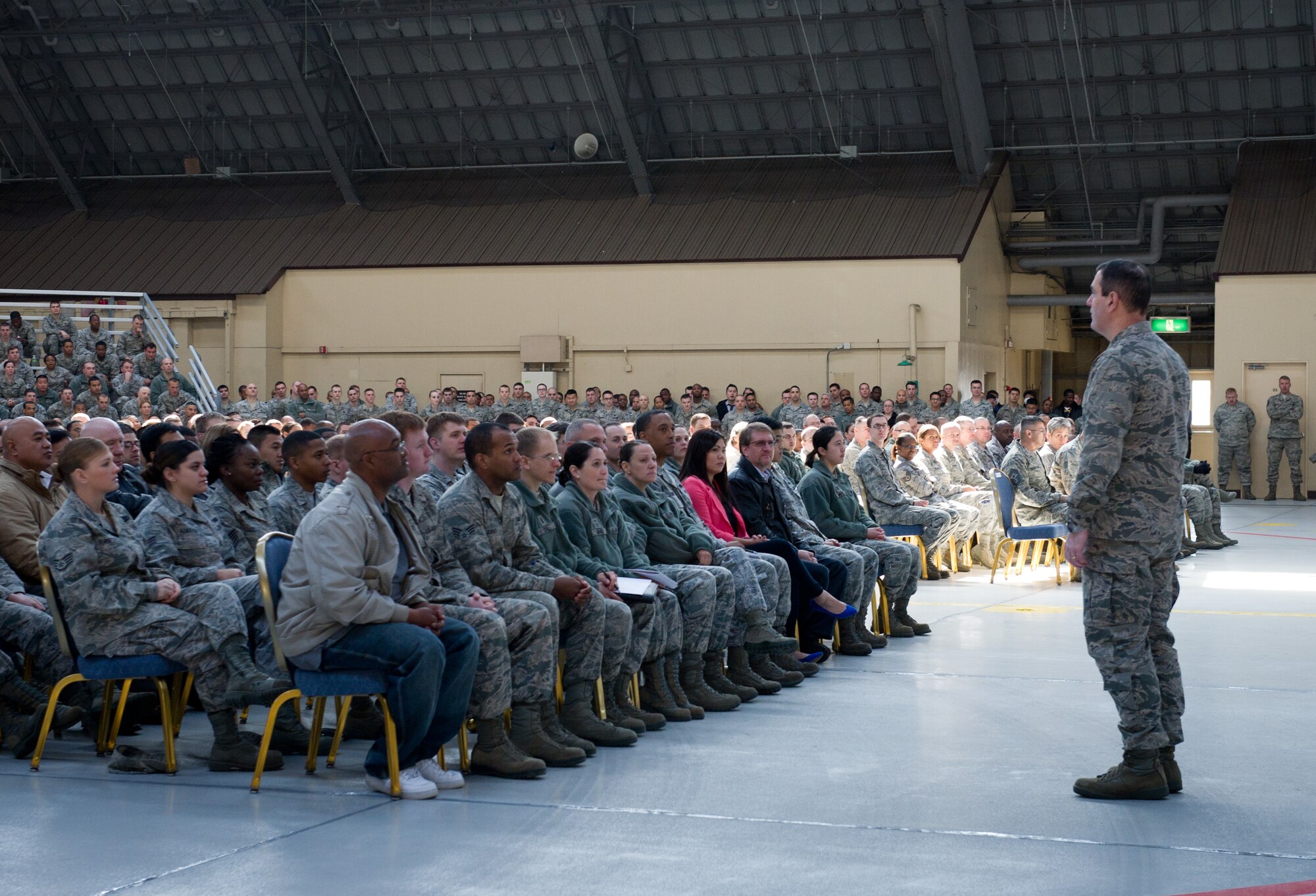 YOKOTA AIR BASE, Japan -- Col. Mark August, 374th Airlift Wing commander, addresses his wing during a commander's call at Yokota Air Base, Japan, March 12, 2013. August discussed the way ahead for Yokota, which, like other U.S. military installations, faces significant budget cuts as a result of sequestration. He stated that now is in fact a good time to be at Yokota, since the wing's current challenges present opportunities for leaders and their teams to prove themselves. (U.S. Air Force photo by Senior Airman Andrea Salazar)