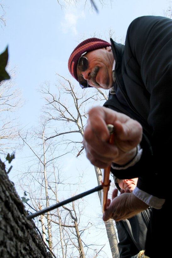 ARLINGTON, Va. – Paul Carter, a Norfolk District forester, takes a bore sample of a fallen red oak tree in the Arlington National Cemetery’s Millennium Project boundaries here, Feb. 6, 2013. Carter is investigating the age of the trees to ensure the initial estimates on tree ages, documented in the project’s environmental assessment, are correct. The Millennium Project will add 27 acres to the cemetery and nearly 30,000 additional burial and niche spaces. (U.S. Army photo/Patrick Bloodgood)